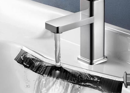 Chrome faucet with water flowing into a sink, WSGENIE branding visible.