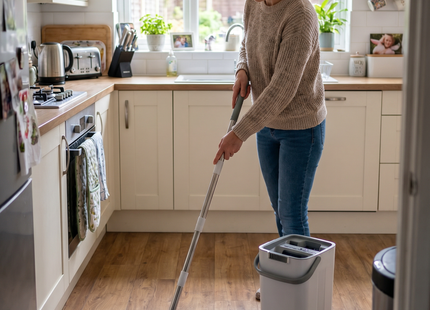 Woman mopping a floor with the WSGenie flat mop and bucket set